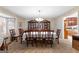 Formal dining room features large table with chairs, china cabinet, and carpeted floor at 75 Antioch Rd, Mcdonough, GA 30252