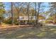 Charming home with metal roof, covered porch, mature trees, and covered parking at 75 Antioch Rd, Mcdonough, GA 30252