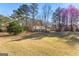 Quaint home featuring a metal roof, carport, and a large, well-maintained yard at 75 Antioch Rd, Mcdonough, GA 30252