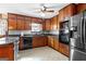The kitchen has wood cabinets, stainless steel appliances, and a tiled floor at 75 Antioch Rd, Mcdonough, GA 30252