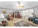 Comfortable living room featuring carpet, floral wallpaper, and ample seating at 75 Antioch Rd, Mcdonough, GA 30252