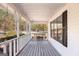 Inviting covered porch with a wooden swing, perfect for relaxing outdoors at 75 Antioch Rd, Mcdonough, GA 30252