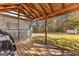 Covered porch with lattice featuring an outdoor seating area and backyard views at 75 Antioch Rd, Mcdonough, GA 30252