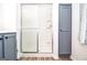 Walk-in shower, built-in shelving and stylish cabinetry in bathroom at 830 Montego Sw Way, Lilburn, GA 30047