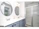 Bathroom features double sinks and a glass-enclosed shower at 830 Montego Sw Way, Lilburn, GA 30047
