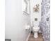 Compact bathroom featuring a standard toilet and stylish shower curtain at 830 Montego Sw Way, Lilburn, GA 30047