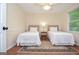 Bedroom featuring two twin beds, hardwood flooring, and natural light at 830 Montego Sw Way, Lilburn, GA 30047