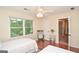 Bedroom featuring hardwood floors, a ceiling fan, and natural light at 830 Montego Sw Way, Lilburn, GA 30047