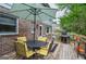 Inviting outdoor deck area with a grill, seating, and lush greenery, perfect for outdoor gatherings and enjoyment at 830 Montego Sw Way, Lilburn, GA 30047