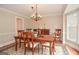 Formal dining room with traditional furniture and chandelier lighting at 830 Montego Sw Way, Lilburn, GA 30047