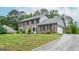 Two-story brick home with an attached garage and meticulously maintained landscaping offers classic charm at 830 Montego Sw Way, Lilburn, GA 30047