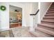 Welcoming foyer featuring tiled floors, a staircase, and a glimpse into the elegant living spaces at 830 Montego Sw Way, Lilburn, GA 30047