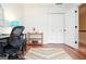 Inviting home office featuring hardwood floors, neutral walls, and a bright workspace with a modern desk and decor at 830 Montego Sw Way, Lilburn, GA 30047