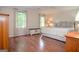 Main bedroom features hardwood flooring, neutral colors, and bright windows with natural light at 830 Montego Sw Way, Lilburn, GA 30047