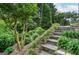 Beautifully landscaped stone steps leading through the garden, showcasing the exterior's charm at 830 Montego Sw Way, Lilburn, GA 30047