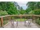 Relaxing wooden deck overlooking the backyard, furnished with chairs for outdoor seating at 830 Montego Sw Way, Lilburn, GA 30047