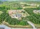 Beautiful property with lush forest surroundings and multiple outbuildings at 107 Corinth Reserve Pl, Grantville, GA 30220