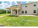 Inviting home exterior with a covered patio overlooking a lush, green backyard at 107 Corinth Reserve Pl, Grantville, GA 30220