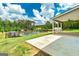 Large back patio overlooking fenced pool and large wooded lot at 107 Corinth Reserve Pl, Grantville, GA 30220