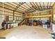 Large barn interior with wooden beams, a spacious loft, and ample storage space for various needs at 107 Corinth Reserve Pl, Grantville, GA 30220