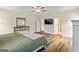 Large bedroom with hardwood floors, a ceiling fan, and lots of light at 107 Corinth Reserve Pl, Grantville, GA 30220