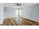 Bright bedroom with a ceiling fan and wood-look floors at 107 Corinth Reserve Pl, Grantville, GA 30220