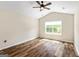 Bedroom with hardwood floors, ceiling fan, and natural light at 107 Corinth Reserve Pl, Grantville, GA 30220