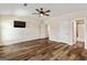 Spacious bedroom with TV, hard wood floors and ceiling fan at 107 Corinth Reserve Pl, Grantville, GA 30220