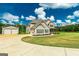 Lovely exterior view of house with a long driveway and multiple buildings at 107 Corinth Reserve Pl, Grantville, GA 30220