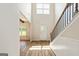 Bright and airy foyer with hardwood floors, an open floorplan, and modern finishes at 107 Corinth Reserve Pl, Grantville, GA 30220