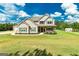 Charming two-story home with manicured front yard and lush green lawn at 107 Corinth Reserve Pl, Grantville, GA 30220