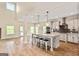Modern kitchen with stainless steel appliances, a large island, and hardwood floors at 107 Corinth Reserve Pl, Grantville, GA 30220