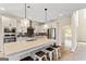 Bright kitchen with an island, granite countertops, and modern appliances at 107 Corinth Reserve Pl, Grantville, GA 30220