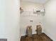 Laundry room featuring a shelf and hookups for washer and dryer at 107 Corinth Reserve Pl, Grantville, GA 30220
