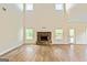 Spacious living room with a stone fireplace and lots of natural light at 107 Corinth Reserve Pl, Grantville, GA 30220