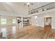 Open concept living space with kitchen, hardwood floors, and modern finishes at 107 Corinth Reserve Pl, Grantville, GA 30220