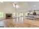 Open concept living space with kitchen, fireplace, and hardwood floors at 107 Corinth Reserve Pl, Grantville, GA 30220