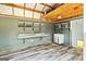 A rustic mudroom with durable flooring, shelving, sink, and a convenient pet door at 107 Corinth Reserve Pl, Grantville, GA 30220