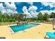 Sparkling in-ground pool with stone accents and comfortable lounging chairs, perfect for relaxation at 107 Corinth Reserve Pl, Grantville, GA 30220