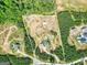 Aerial view of property lines, showcasing land, home, barn, outbuilding, and wooded areas at 107 Corinth Reserve Pl, Grantville, GA 30220