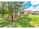 Expansive yard with shed, partially fenced with wooded backdrop at 107 Corinth Reserve Pl, Grantville, GA 30220