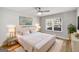 This bedroom features a large bed, stylish lighting, and a ceiling fan for comfortable living at 27 Lakes Edge Se Dr, Smyrna, GA 30080