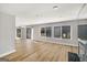 Open living room with hardwood floors, fireplace and natural lighting at 27 Lakes Edge Se Dr, Smyrna, GA 30080