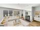 Bright living room boasts hardwood floors, fireplace, and large windows at 27 Lakes Edge Se Dr, Smyrna, GA 30080