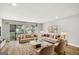 Spacious living room with natural light, stylish furniture, and access to outdoor area at 27 Lakes Edge Se Dr, Smyrna, GA 30080