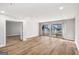 Bright living room with sliding doors to deck and light wood-colored flooring provides ample natural light at 27 Lakes Edge Se Dr, Smyrna, GA 30080