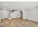 Spacious room with light wood-colored flooring and a staircase provides ample space for living at 27 Lakes Edge Se Dr, Smyrna, GA 30080