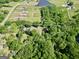 Aerial image outlining the property's land size, revealing a private estate with pond and wooded areas at 701 Mask Rd, Brooks, GA 30205
