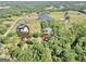 Wide aerial view highlighting home and pond location within the acreage at 701 Mask Rd, Brooks, GA 30205