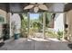 Inviting back porch with a ceiling fan offering scenic views of the lush backyard at 701 Mask Rd, Brooks, GA 30205